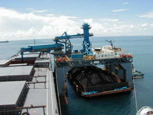 SST transshipping coal from barge to ocean going vessel
